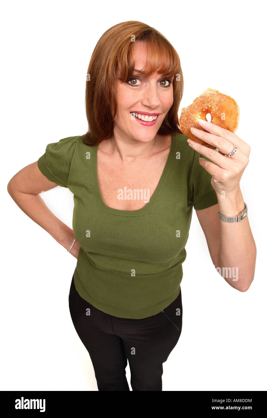 Smiling woman holding a doughnut Stock Photo