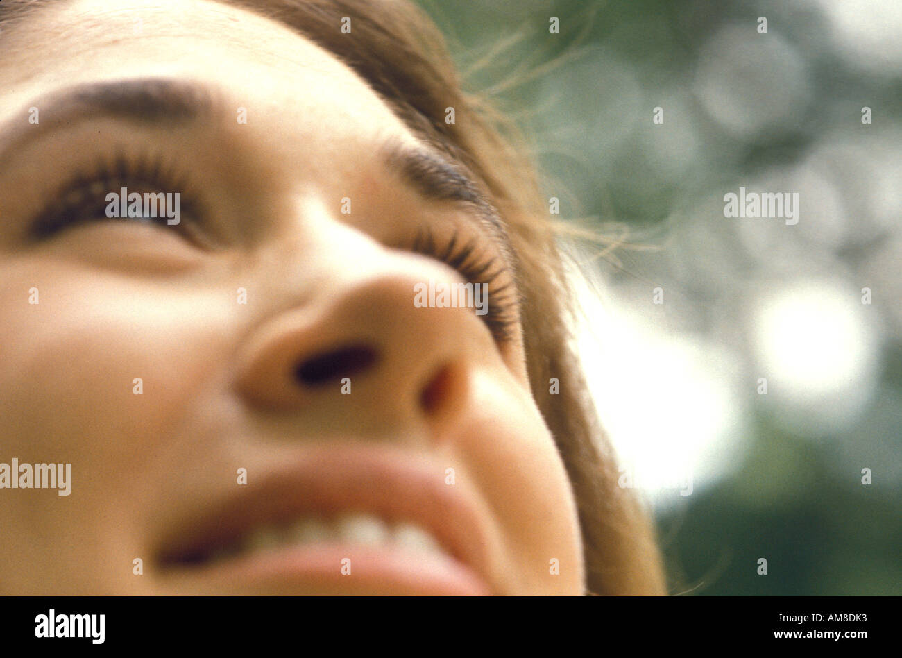 Happy thinking young woman hi-res stock photography and images - Alamy
