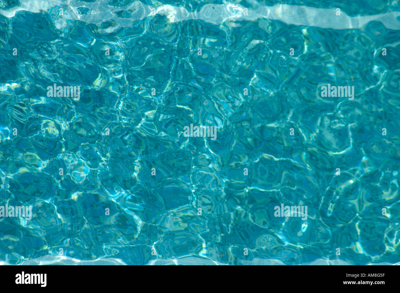 Reflections and refraction with Ripples in water of hotel swimming pool ...