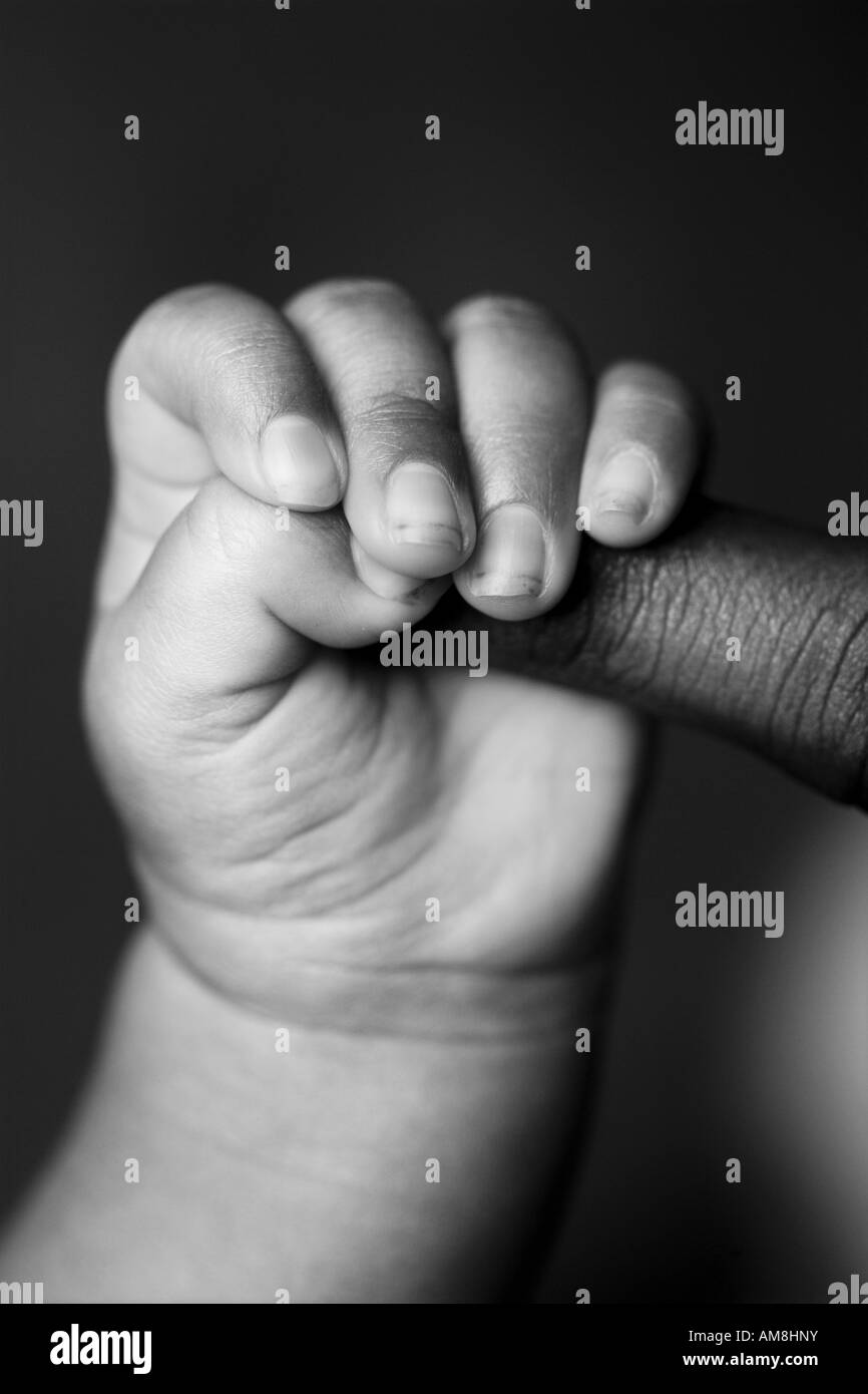 Baby care touching touch fingers black Black and White Stock Photos