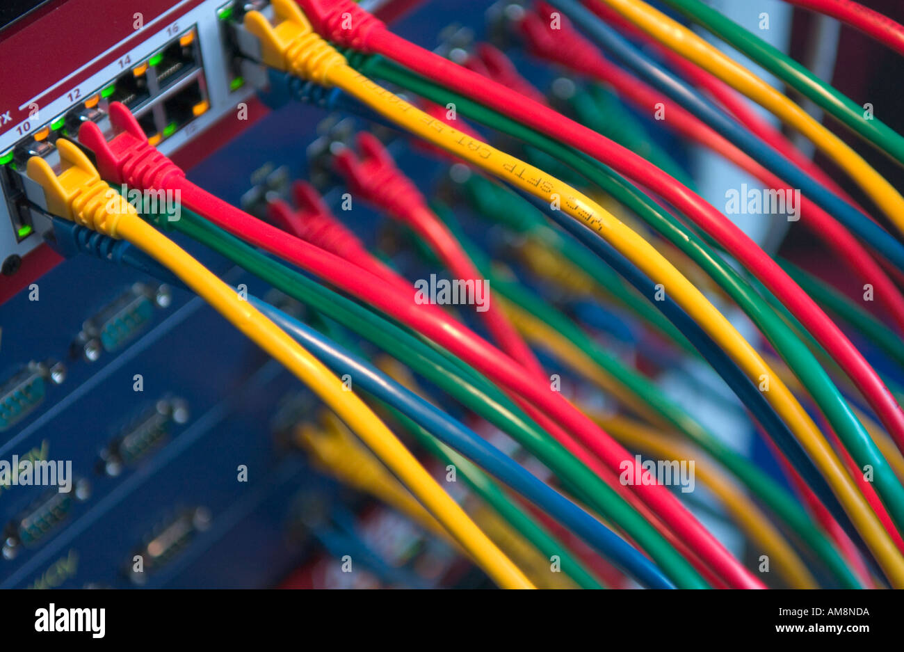colored cables connected to hubs Stock Photo Alamy