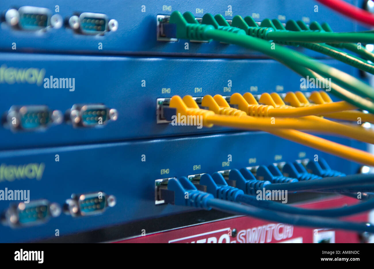 colored cables connected to hubs Stock Photo Alamy