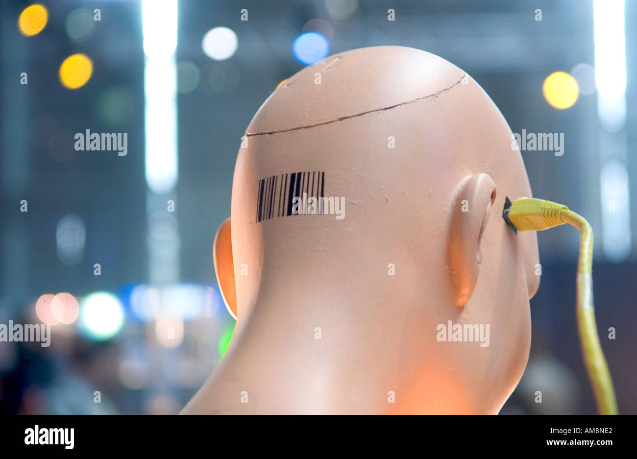 mannequin head with barcode connected to ethernet cable Stock Photo