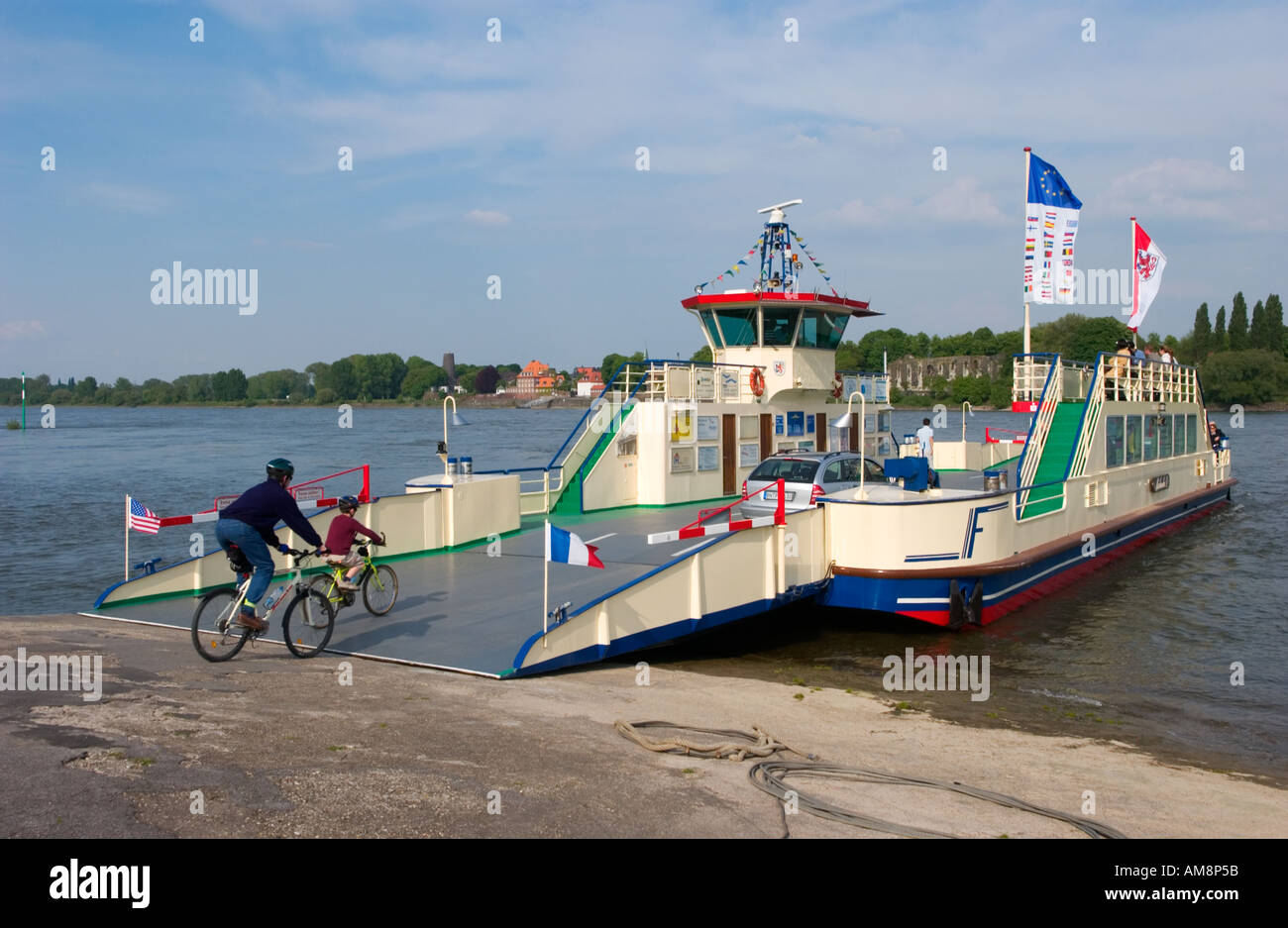 Ferry boat for vehicles and foot passengers crossing the Rhine river between Meerbusch and Kaiserswerth by Duesseldorf Stock Photo