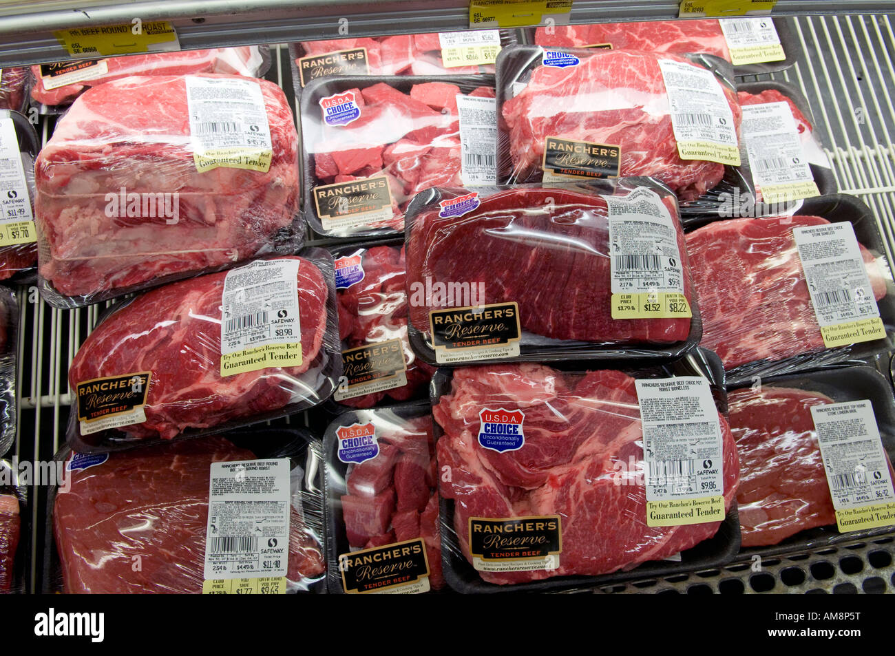 Packaged beef for sale in refrigerated case at a grocery store Stock