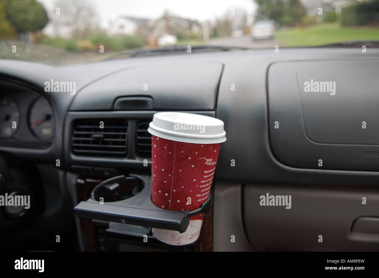 Coffee cup in a cup holder in a car Stock Photo - Alamy