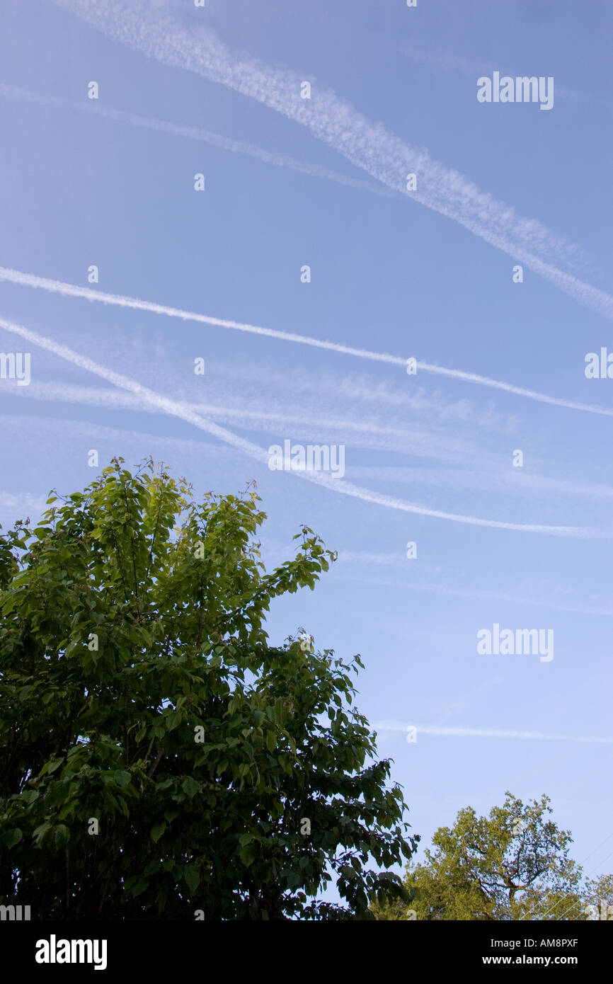 Vapour Trails in Sky from Aircraft Engines Pollution Environment Wales Stock Photo