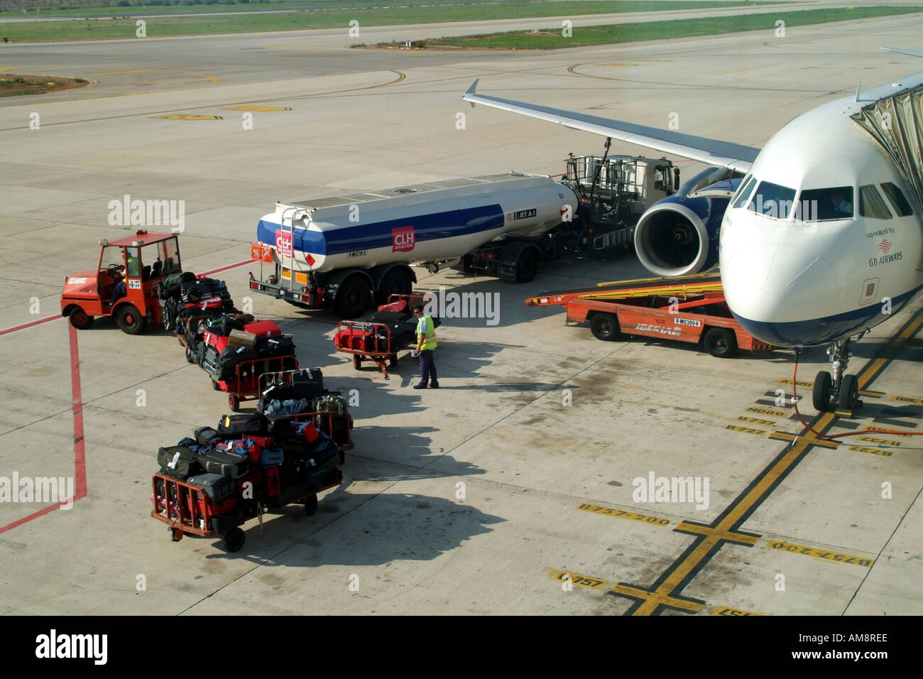 Airbus plane baggage handlers unloading at Palma International Airport