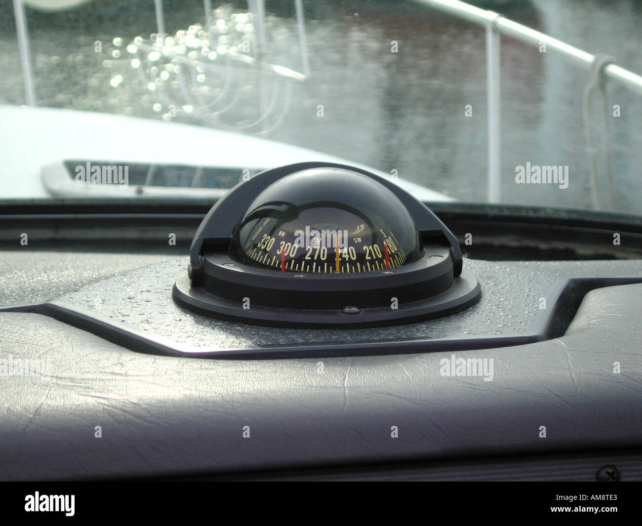 Compass on dashboard of powerboat Stock Photo
