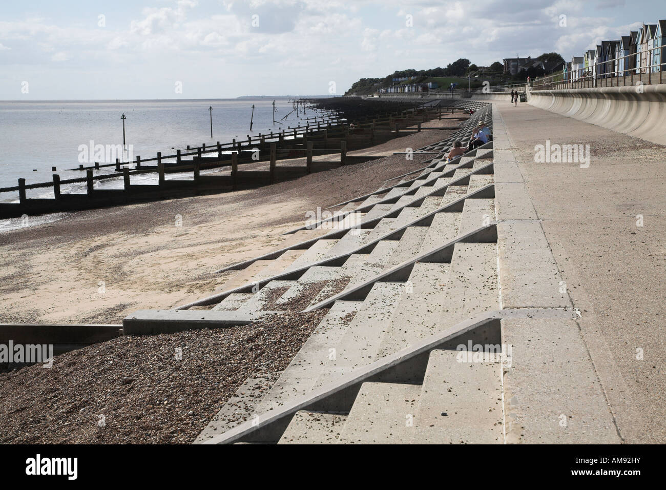 Hard engineering coastal defences sea wall, concrete steps, wooden