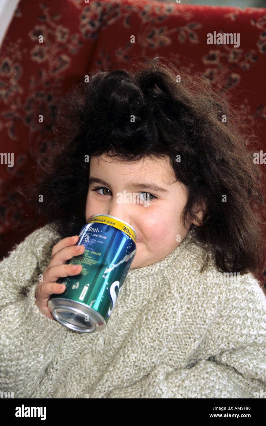 mixed race girl enjoying a fizzy unhealthy drink Stock Photo Alamy