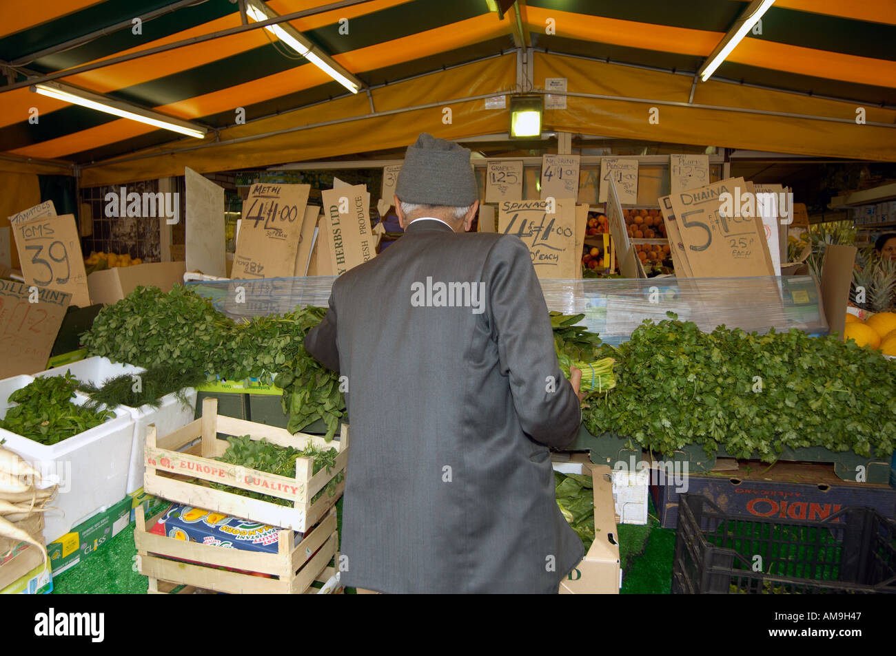 Market stall selling fruit and veg at Green Street East London UK Stock