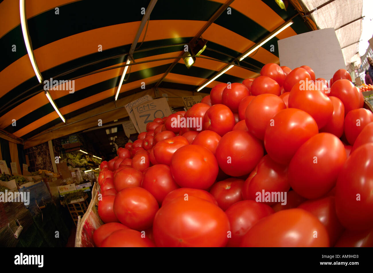 Market stall selling fruit and veg at Green Street East London UK Stock