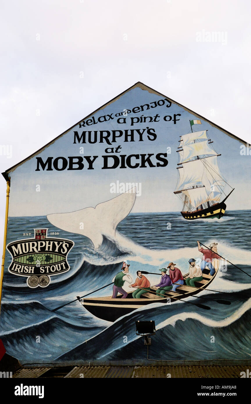 Painted sign on wall of Moby Dicks pub in fishing harbour of Youghal, County Cork, Ireland Stock Photo