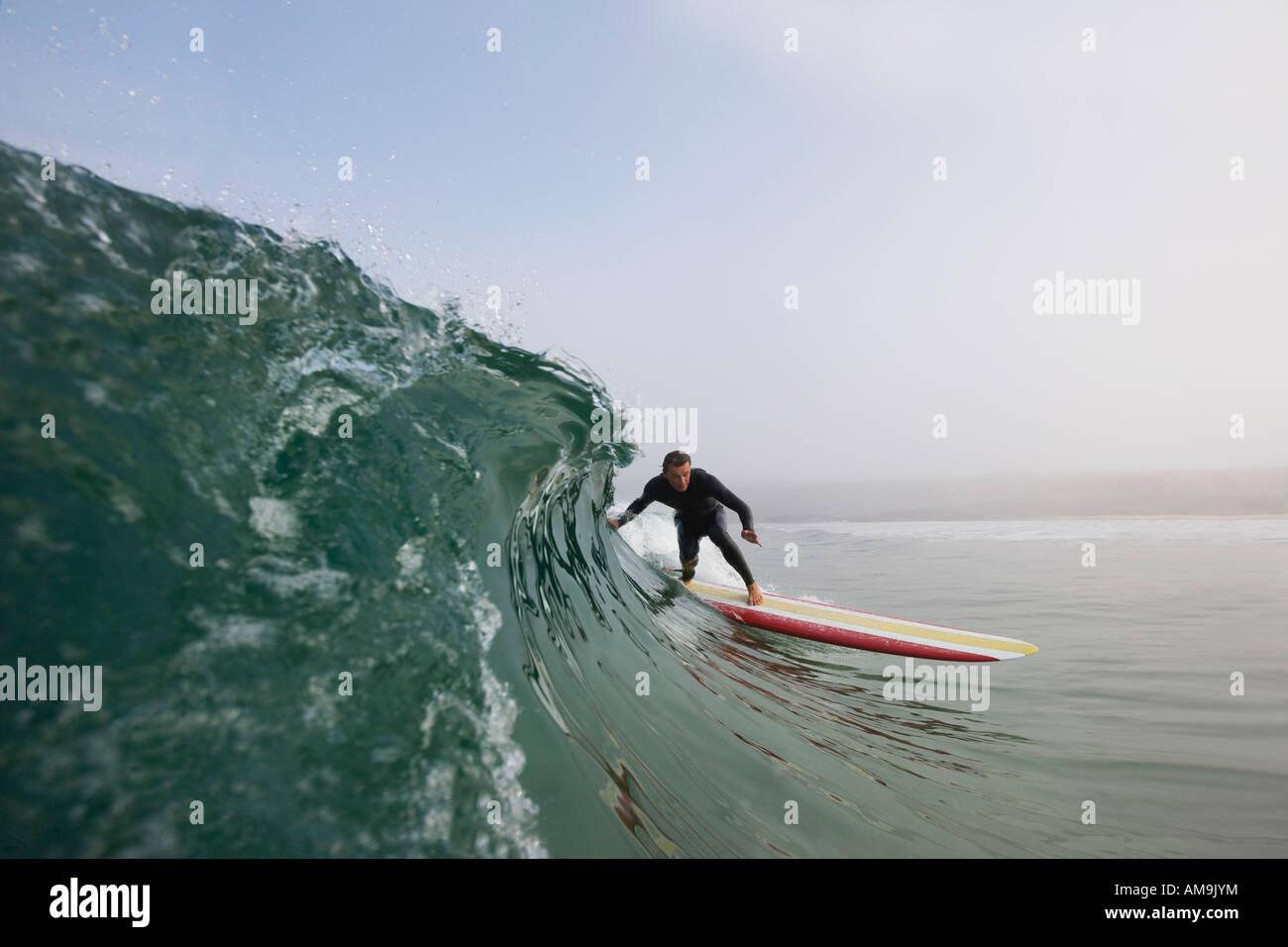 Man surfing a wave. Stock Photo