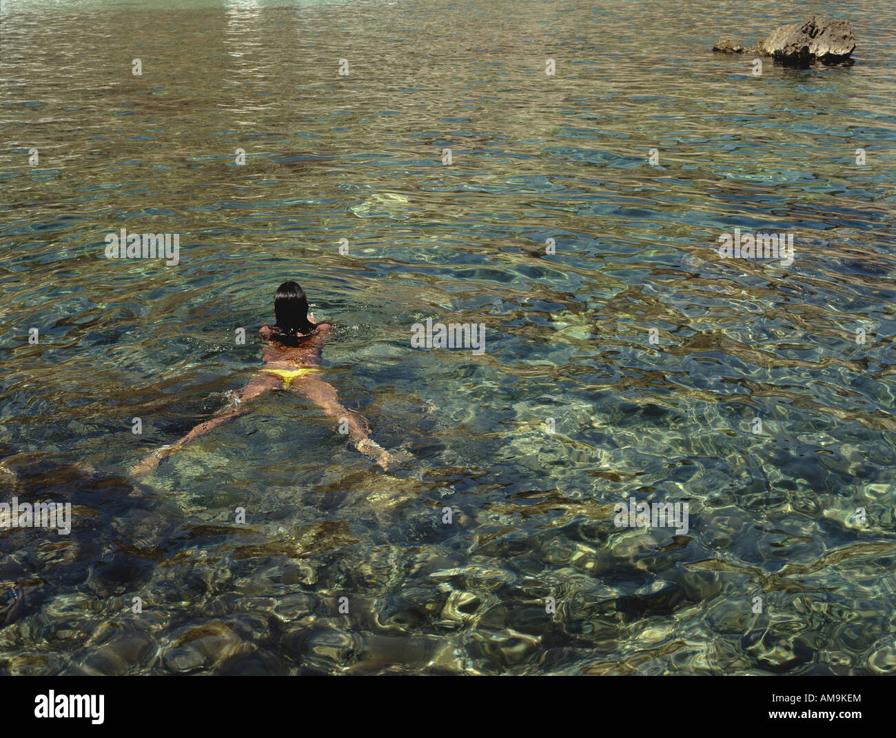 Woman swimming in the water Stock Photo - Alamy