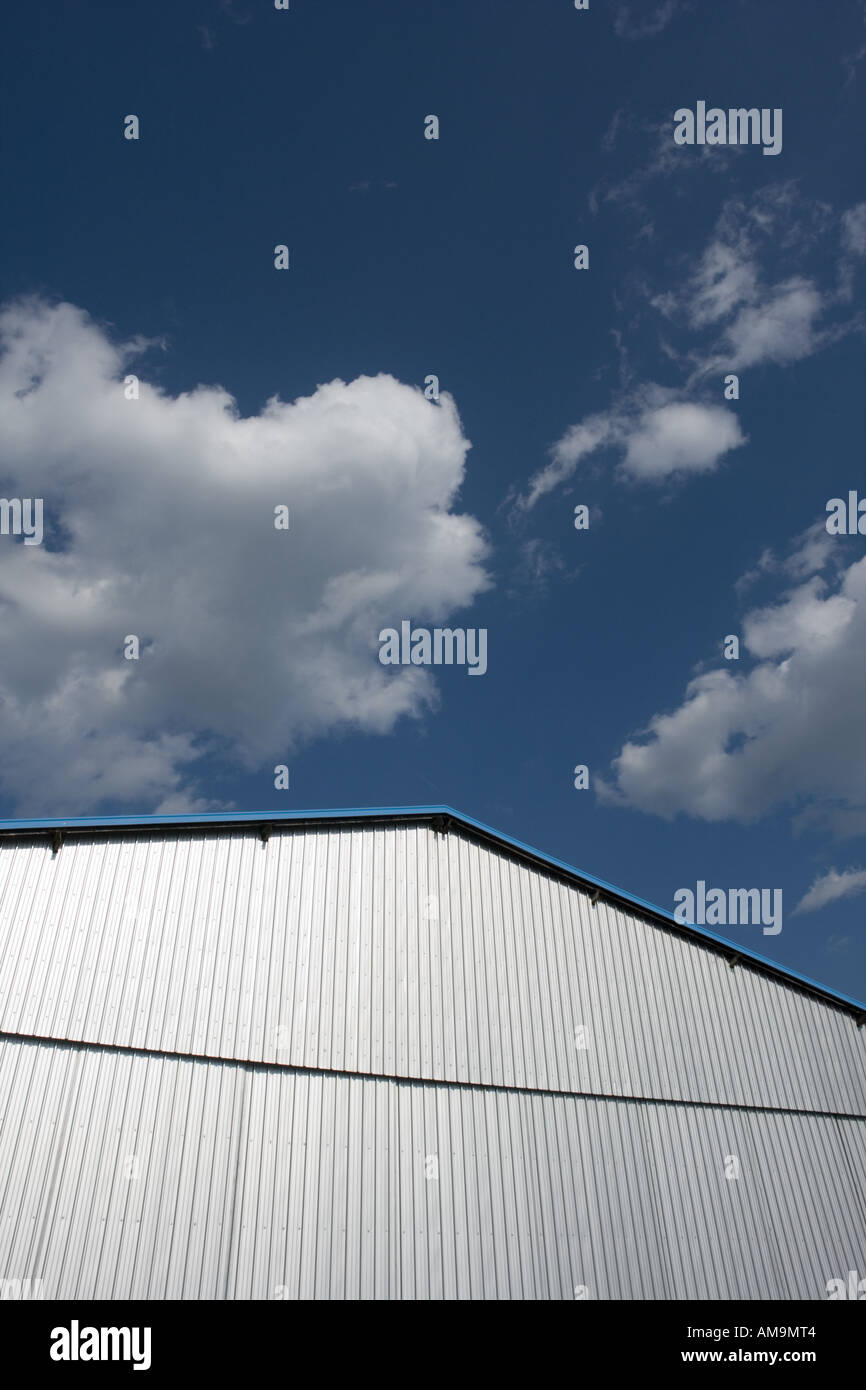 Closed airport hangar doors against cloudy Blue sky Stock Photo