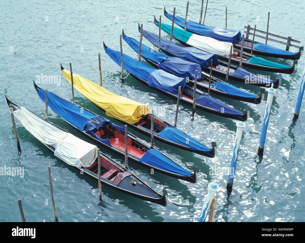 Eight docked gondolas in Venice. Stock Photo