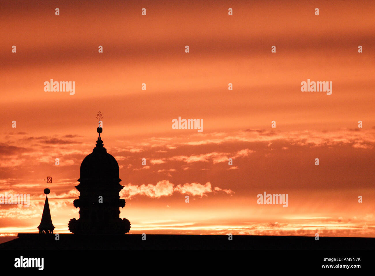 A memorable sunset over the Bavarian city of Munich. The domes of a ...