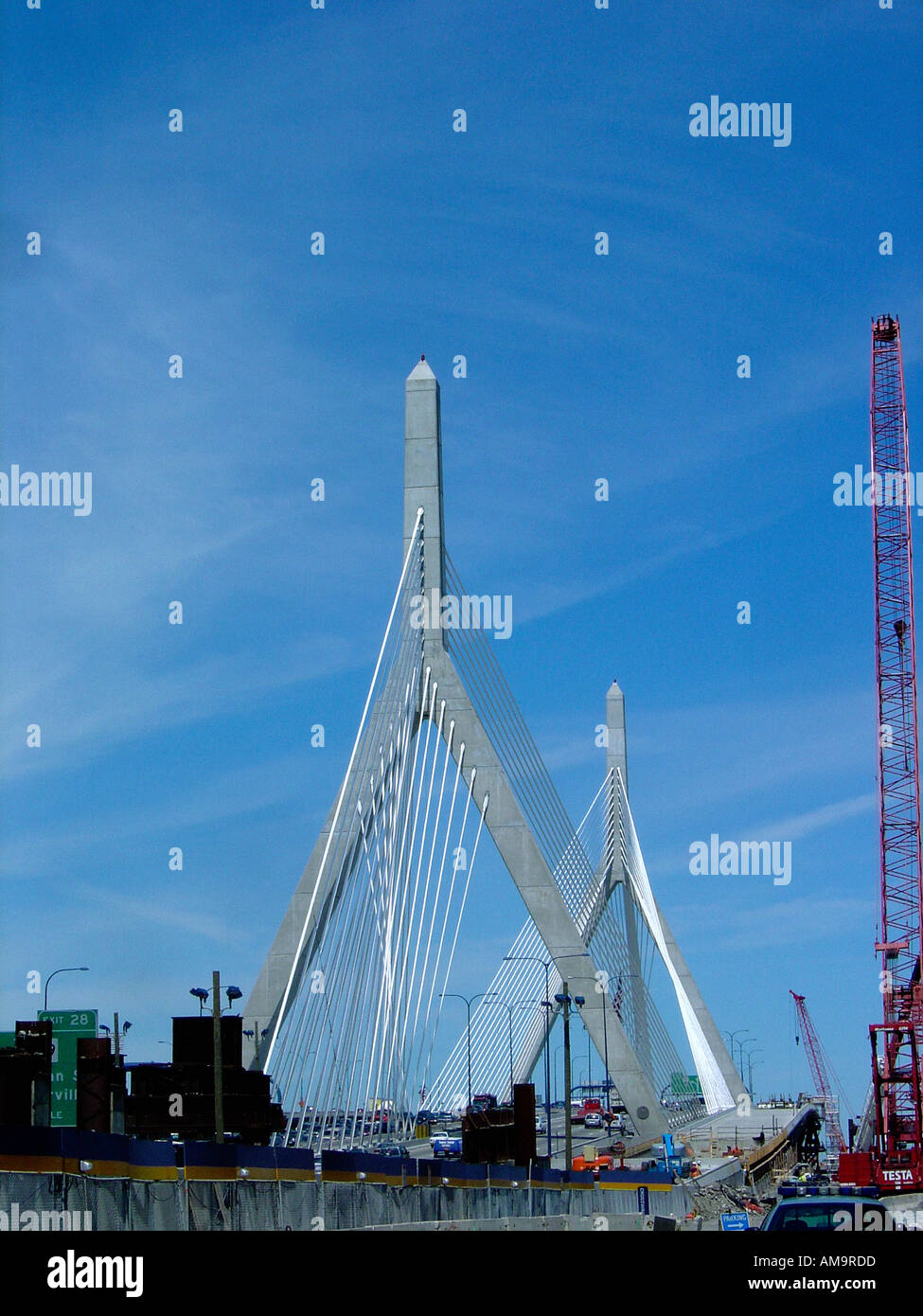 Urban Scene of a Construction Crane and The Leonard P Zakim Bunker Hill Memorial Bridge in Boston Massachusetts USA Stock Photo