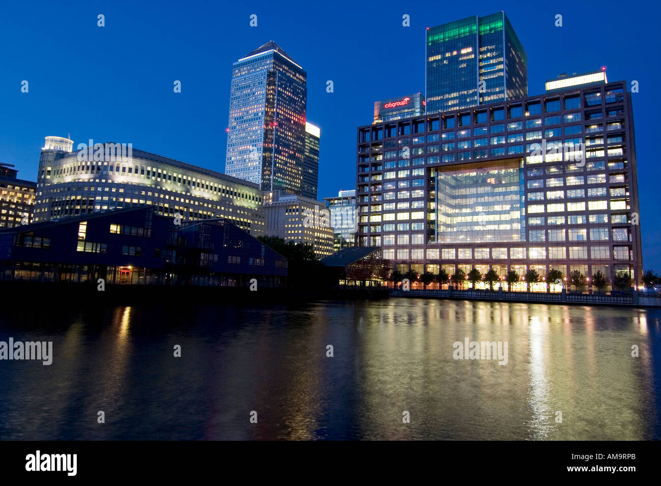 Reuters Canary Wharf tower Citigroup Lehman Brothers (From left to right) London at night Stock Photo