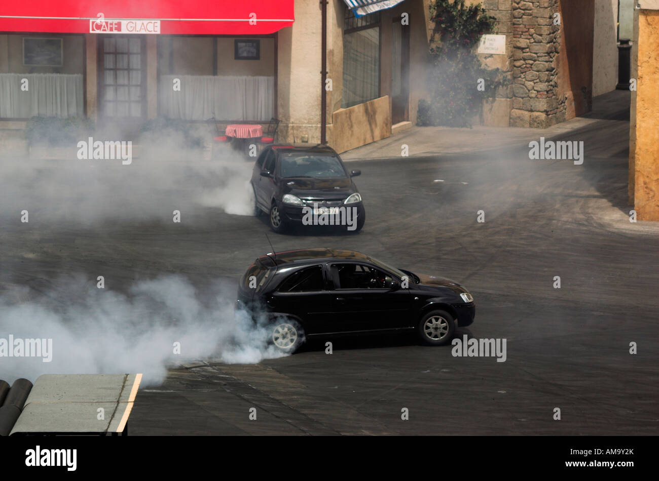 Cars performing in a stunt show Stock Photo