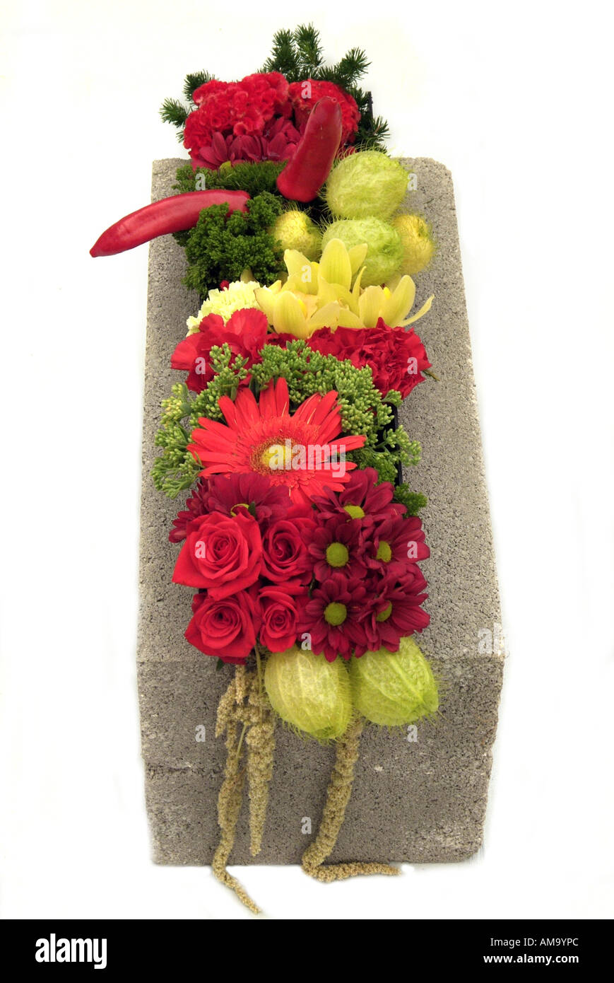 Close up of flower arrangement bloom stone slab building material contrast white background cut out cutout art craft Stock Photo