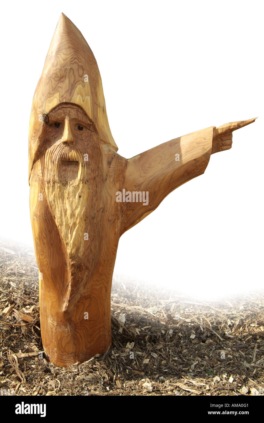 Gnome wood carve chain saw beard ornament sculpture spirit timber spirit mischief folklore magic pagan elf point direction lead Stock Photo