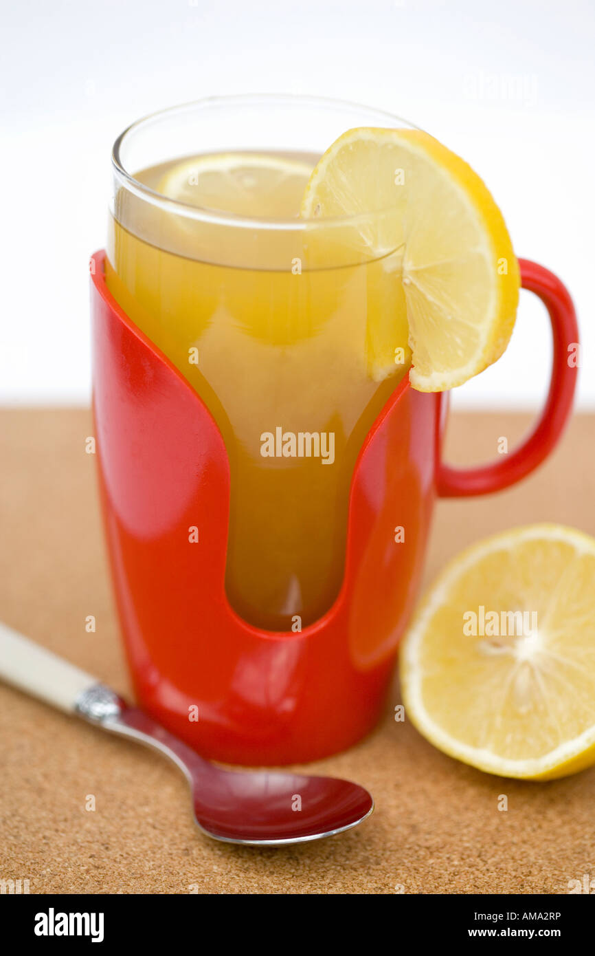 Hot lemon drink served in a retro glass and plastic mug Stock Photo Alamy