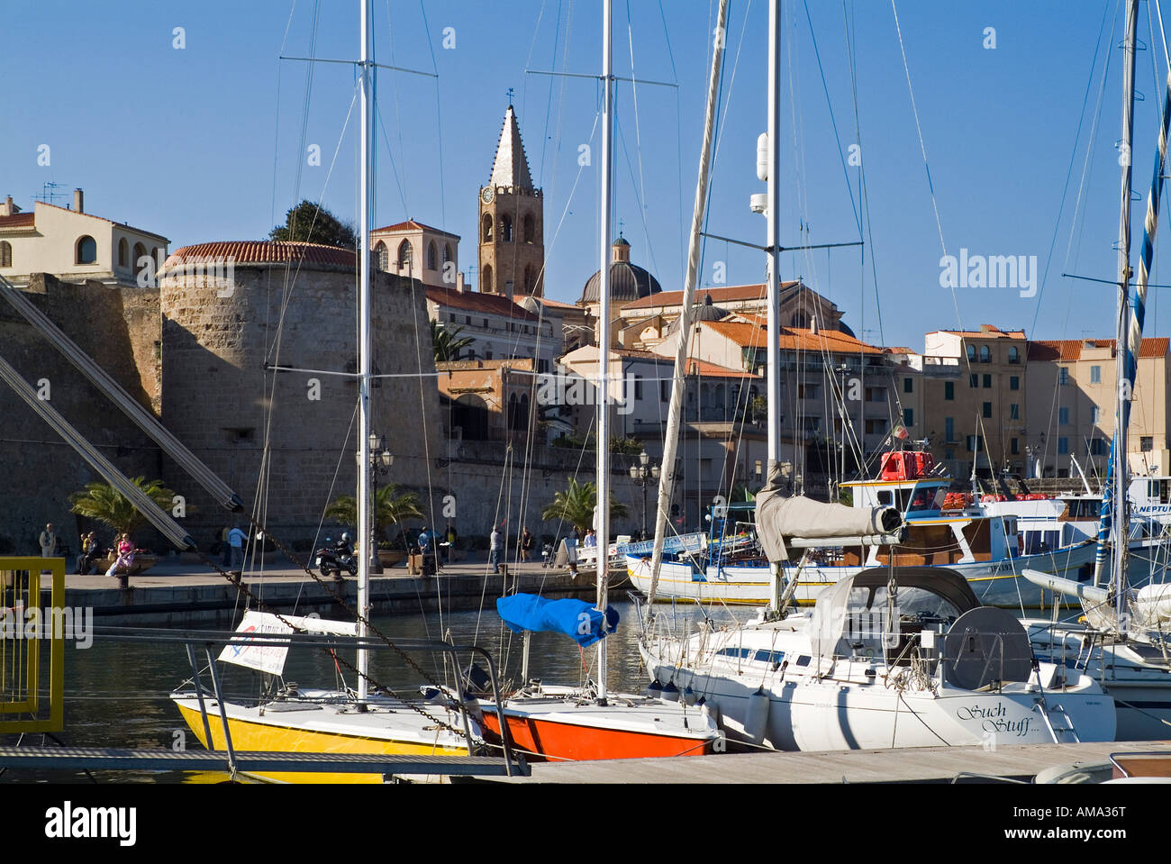 dh Harbour ALGHERO SARDINIA Boats at quayside harbour walls Santa Maria cathedral belltower sailing Stock Photo