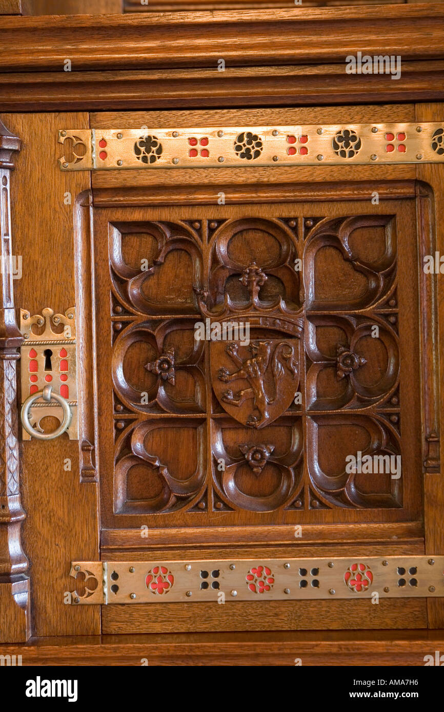 Wales Cardiff Cardiff Castle Banqueting Hall sideboard carved wooden door detail Stock Photo