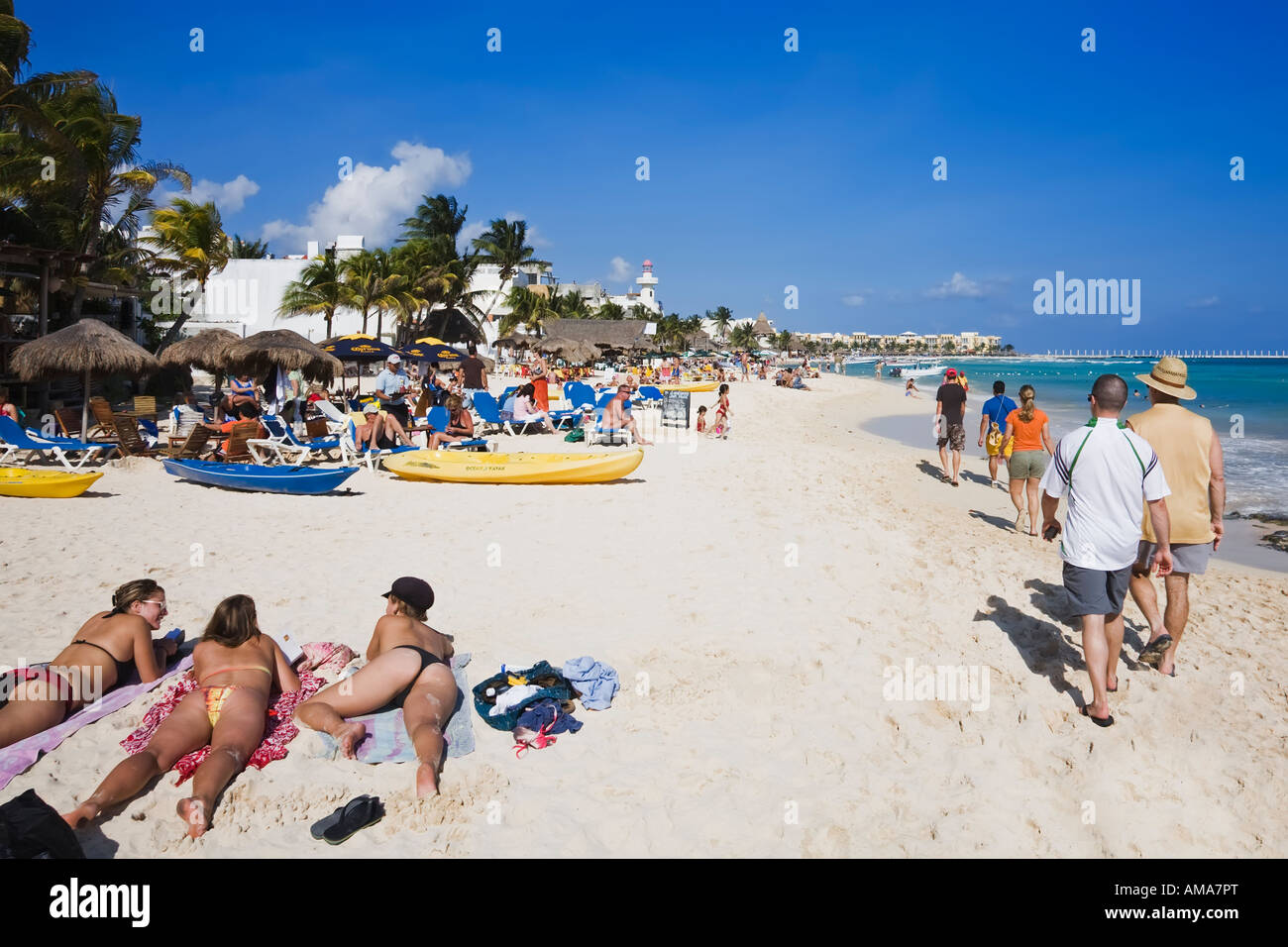 Sunbathers enjoying the turquoise waters and white sand beaches of Playa Del Carmen Stock Photo