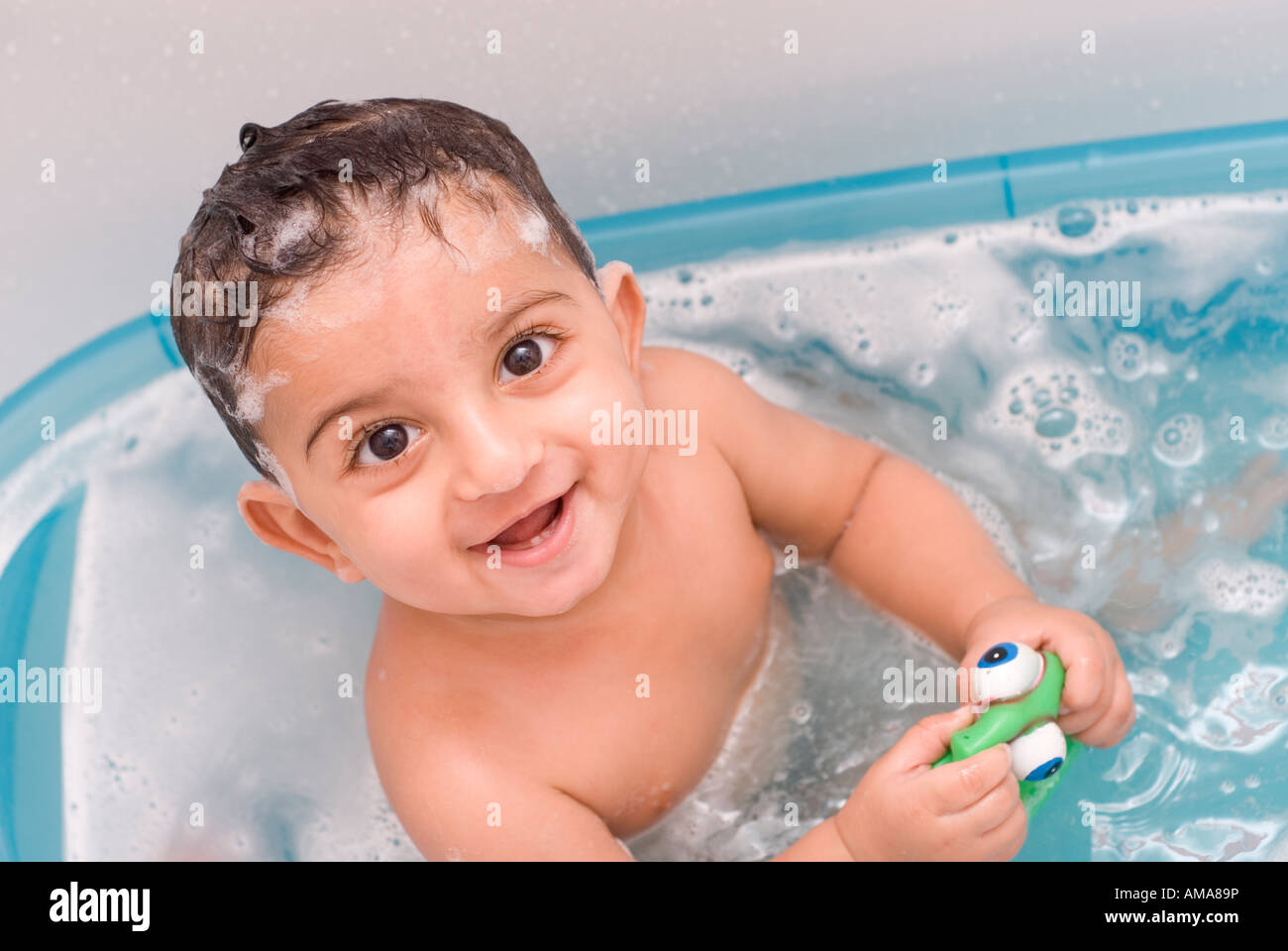 happy baby boy having a bath Stock Photo Alamy