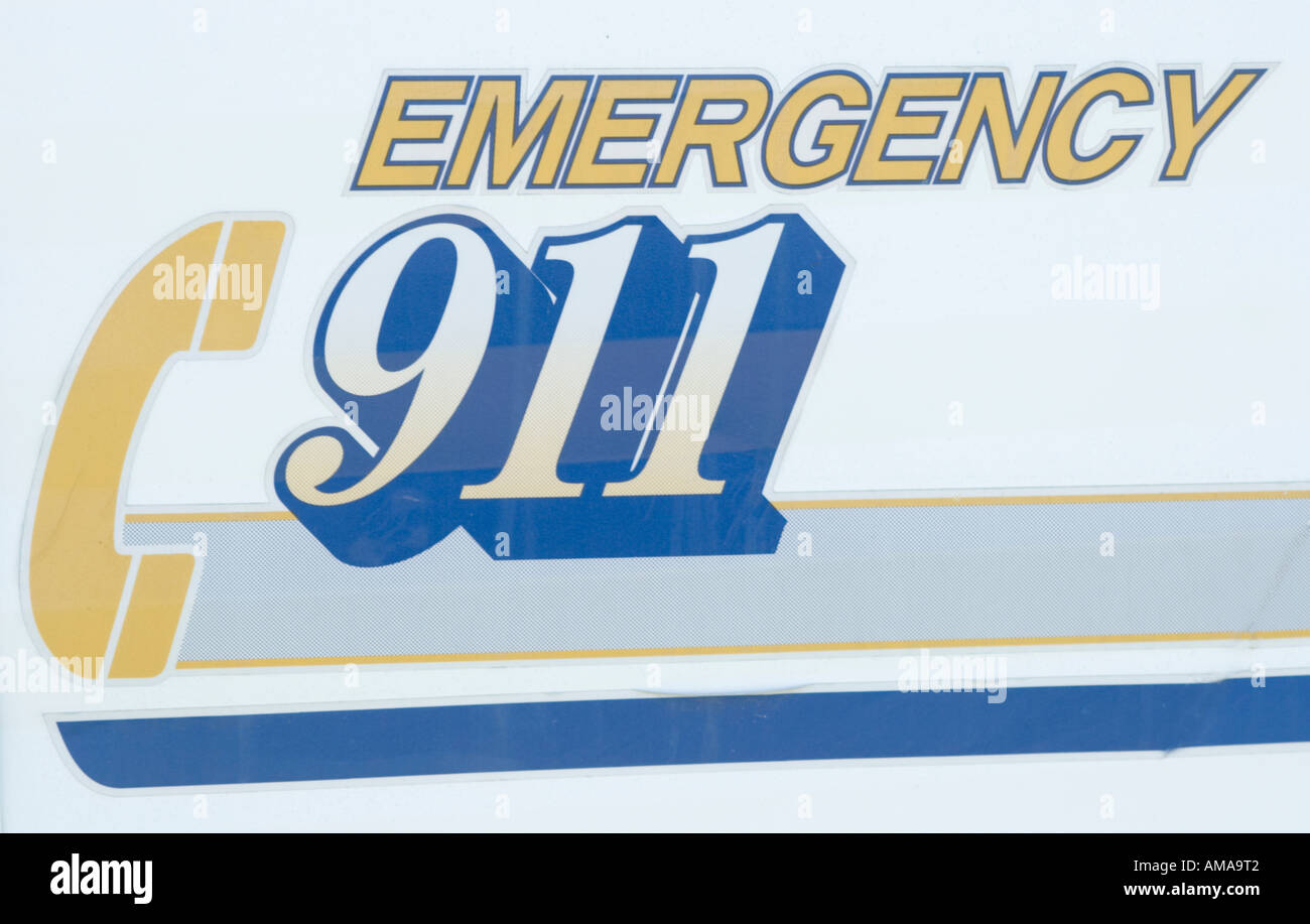 Call Emergency 911 sign on side of vehicle Stock Photo
