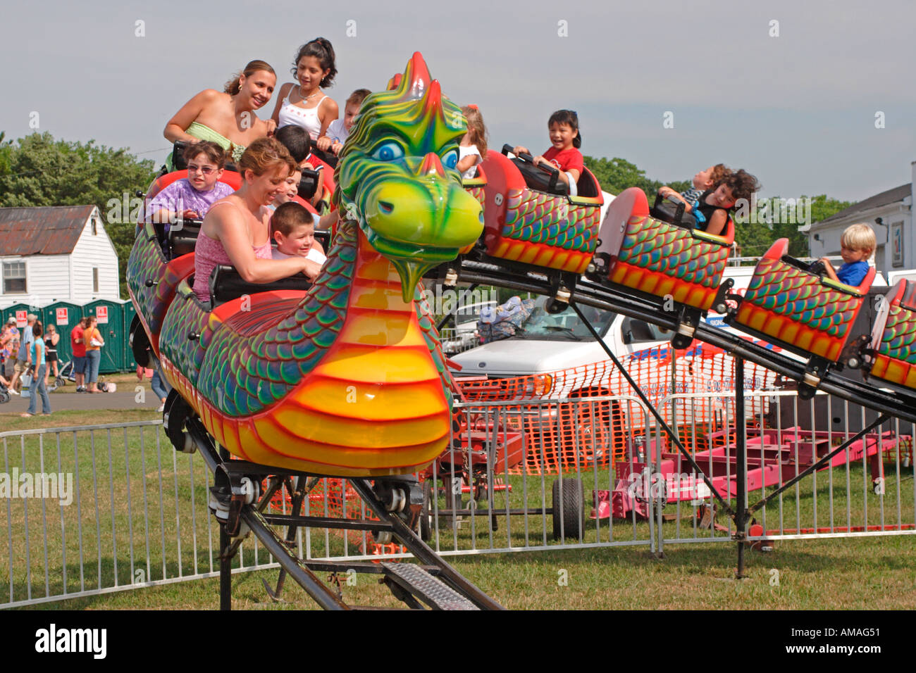 Children And Parents On Dragon Ride At County Fair Stock Photo Alamy