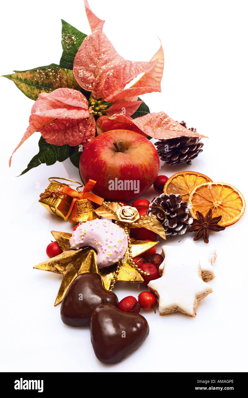 Fruits with confectionery and poinsettia, close-up Stock Photo