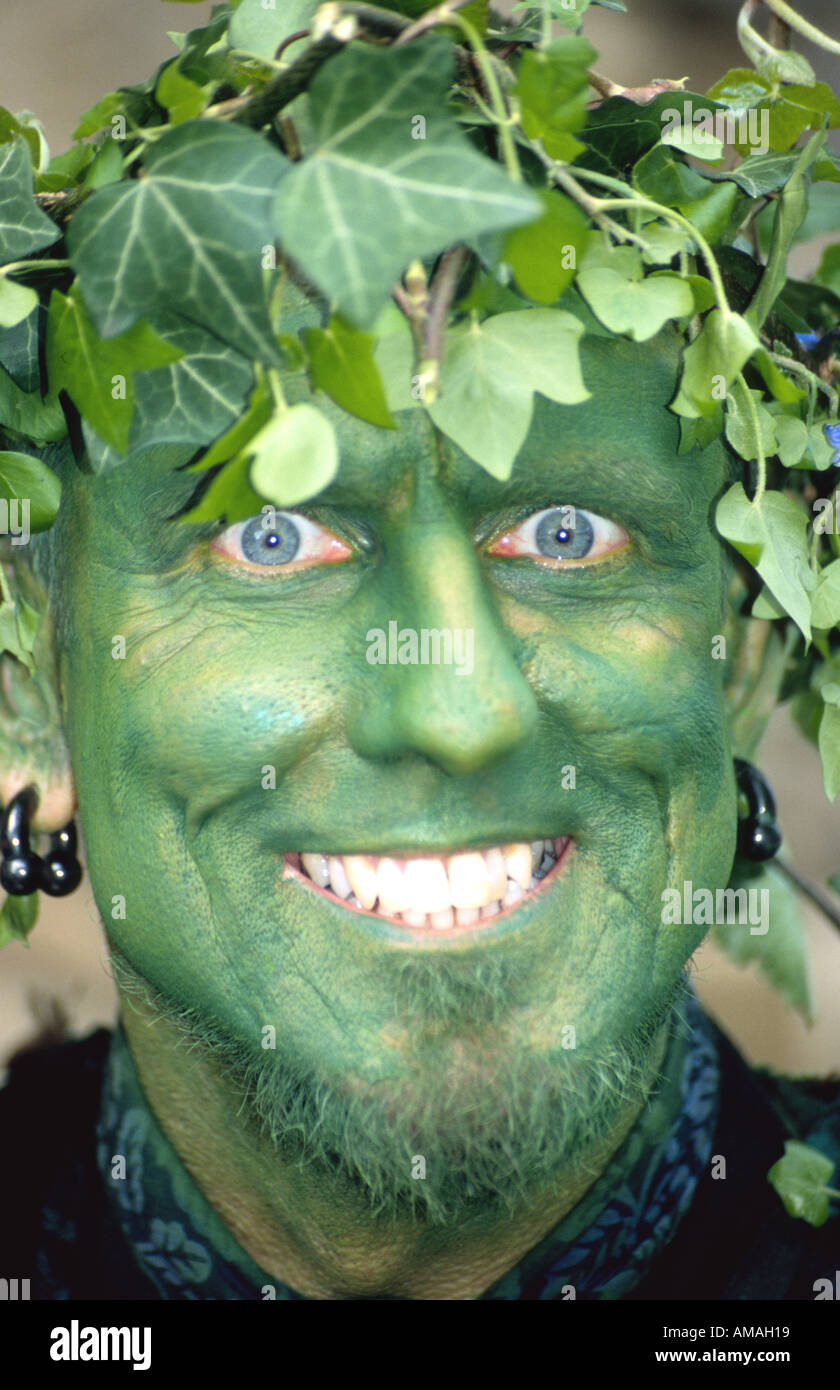 Painted green face of a bogie traditional green men at Jack in the Green pagan festival 2005 Hastings East Sussex UK England Stock Photo