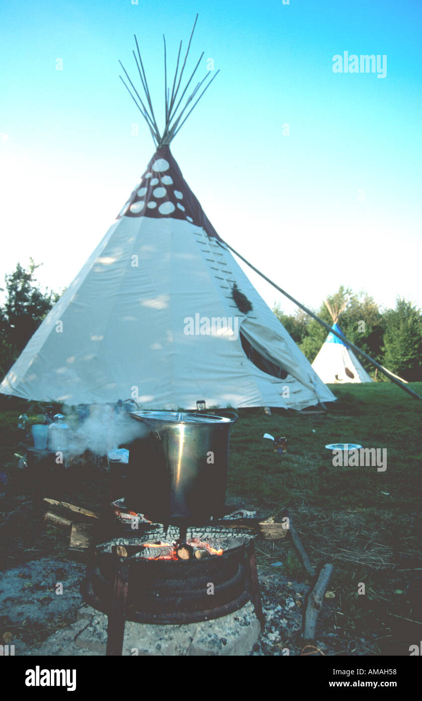 Cooking pot outside tipi in green field Sussex Tipi Holidays Sculdown Vineyard Broad Oak East Sussex UK Stock Photo