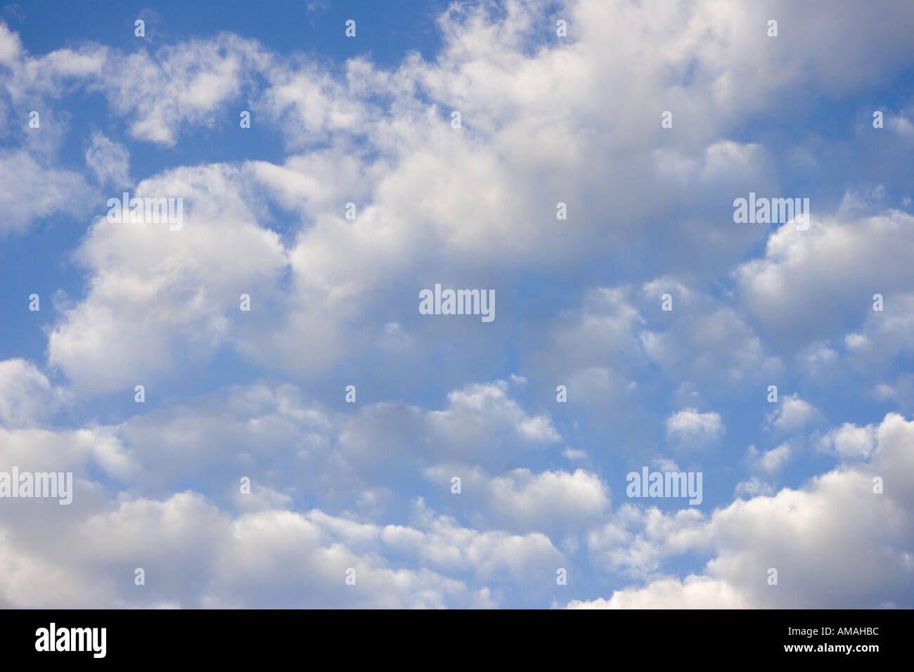 Fluffy white clouds in a blue summer sky Stock Photo - Alamy