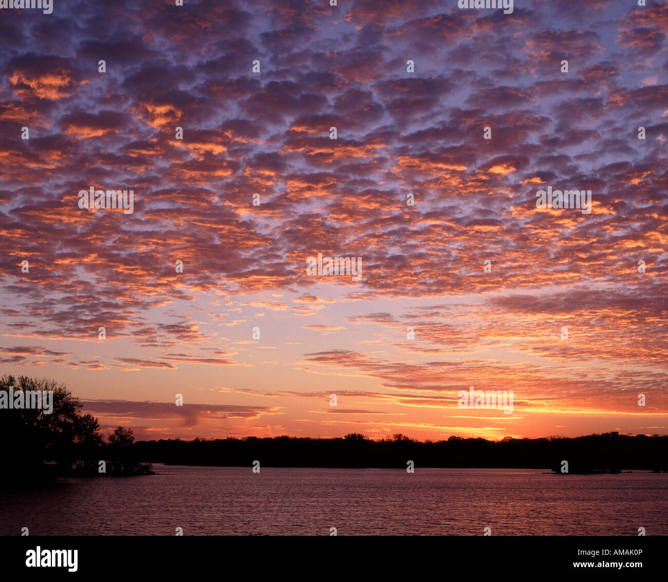 altocumulus clouds at sunrise, Little Spirit Lake, Iowa USA Stock Photo