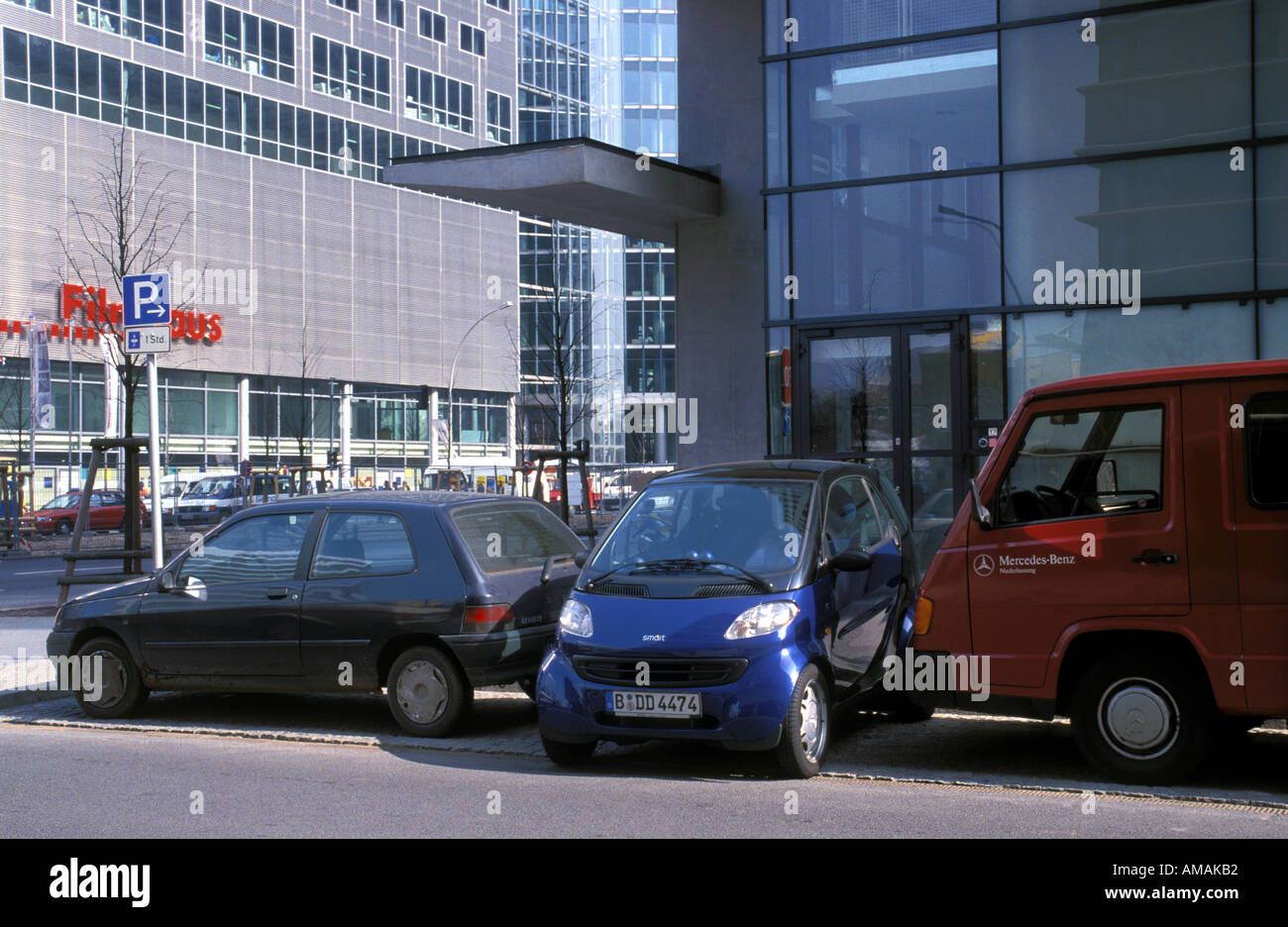 Germany Berlin a Smart car takes advantage of its small size to fit sideways into a narrow parking space Stock Photo