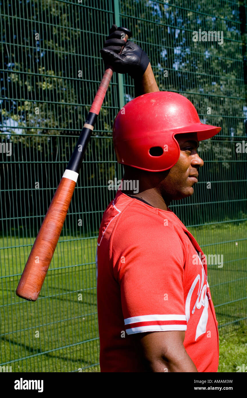 A baseball player holding a baseball bat Stock Photo
