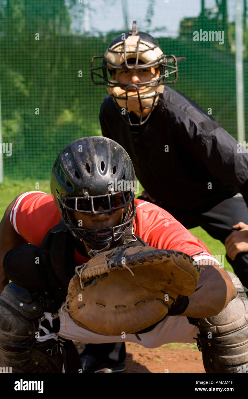 A baseball catcher and an umpire at a game Stock Photo Alamy