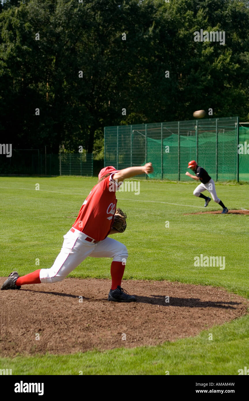 Side view of baseball player throwing a ball Stock Photo - Alamy