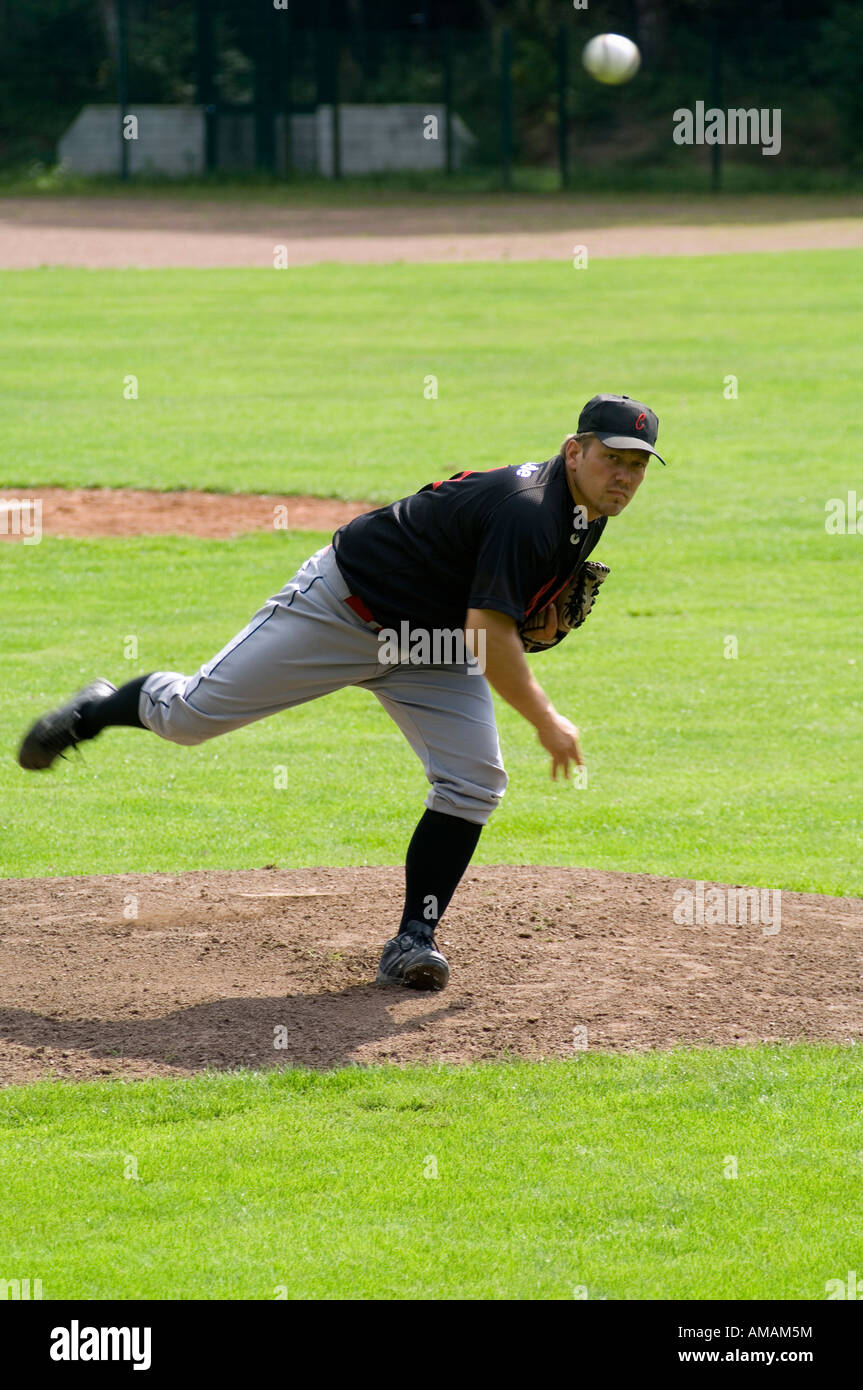 A baseball player throwing a baseball Stock Photo Alamy