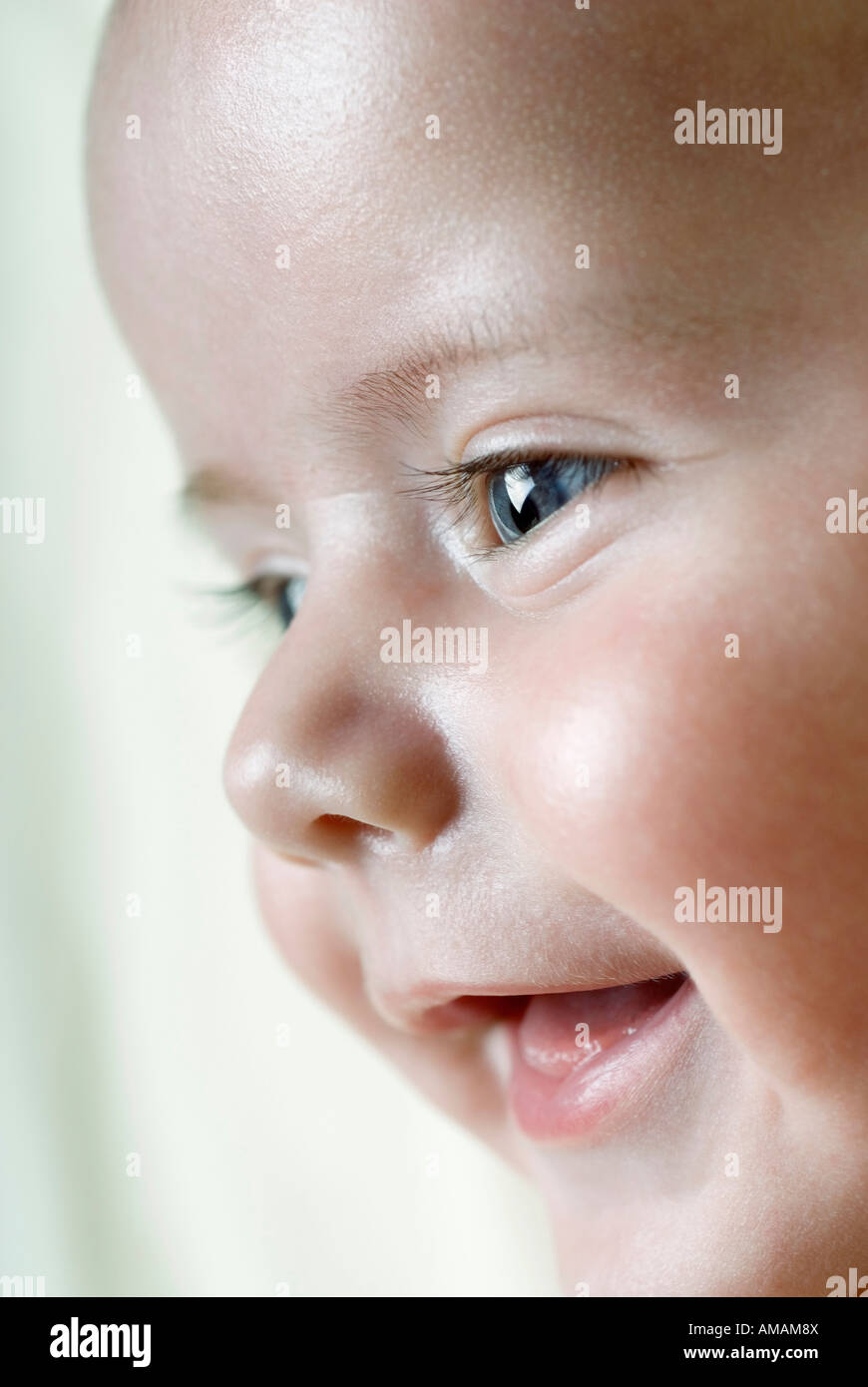 Side view of a baby smiling Stock Photo