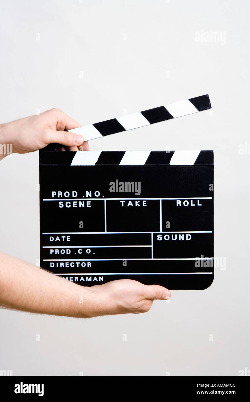 A man holding a movie clapperboard Stock Photo