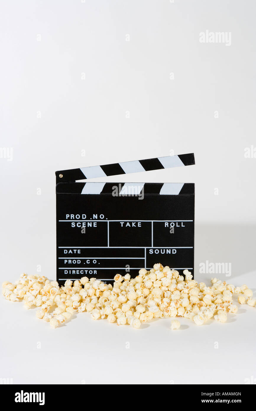 Popcorn and a movie clapperboard Stock Photo