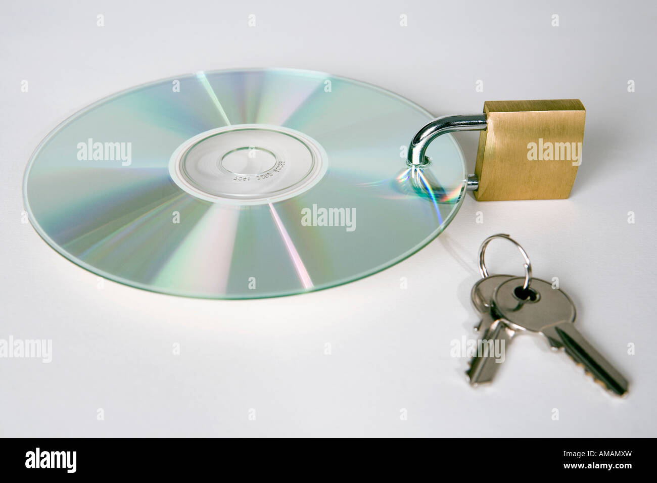 A CD with a padlock and keys Stock Photo Alamy