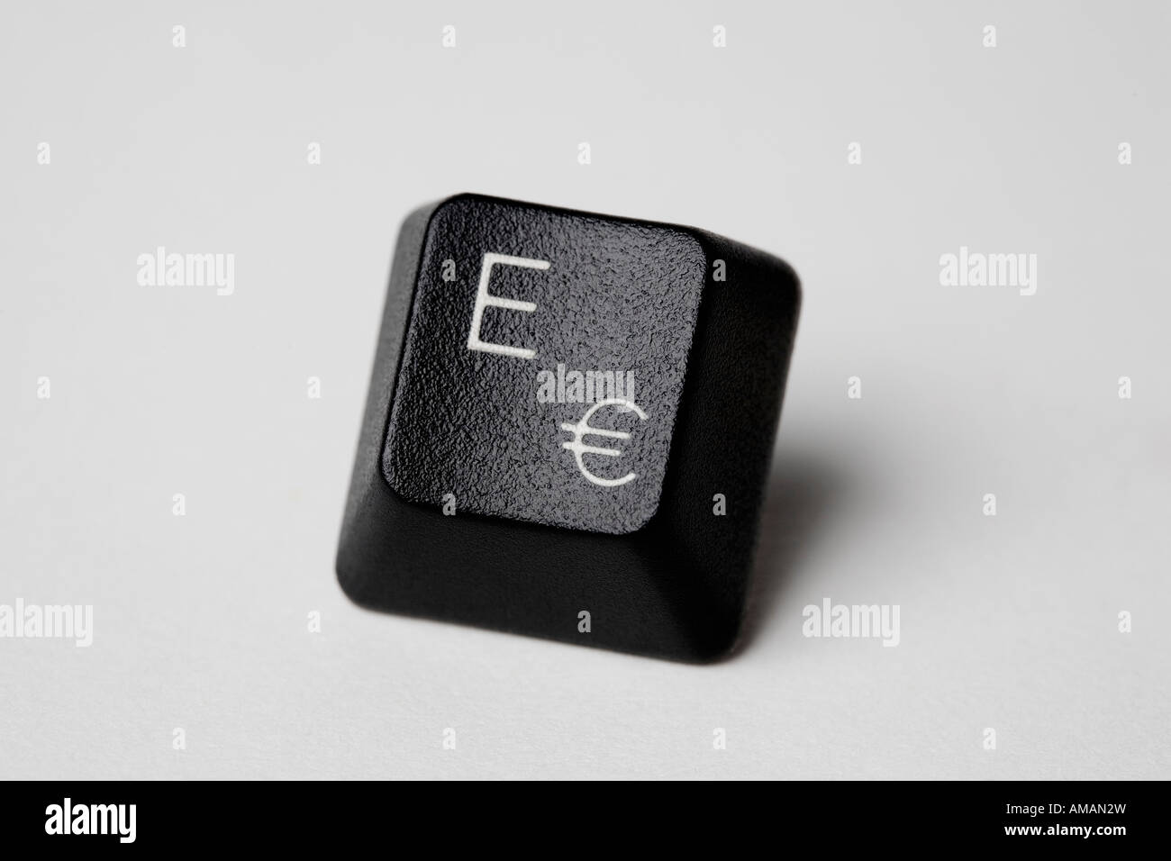 A computer key with the letter E and the Euro symbol Stock Photo